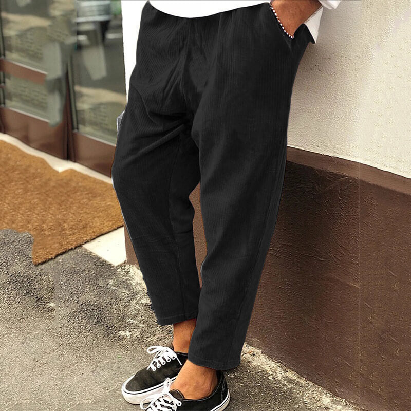 Men's relaxed fit corduroy trousers in neutral tone, casual office style with soft durable fabric