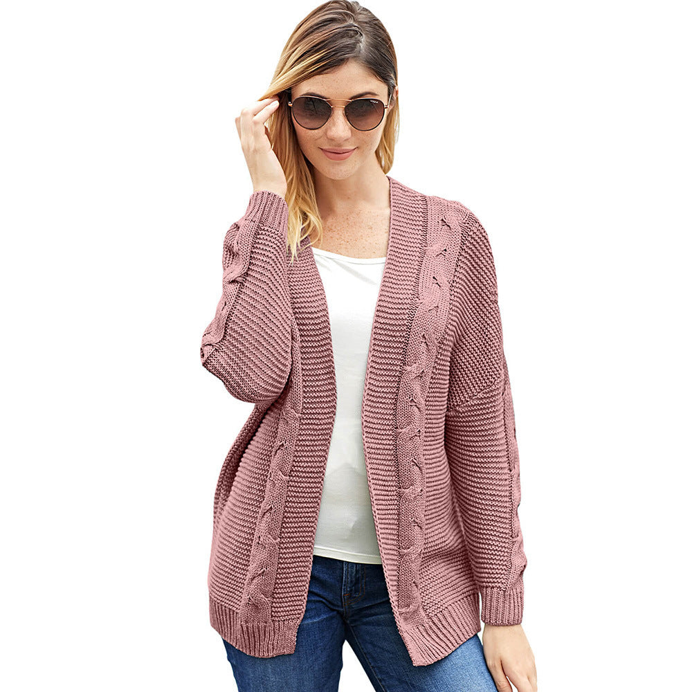Women's oversized open-front cardigan in chunky cable-knit, cozy casual layering piece for everyday style