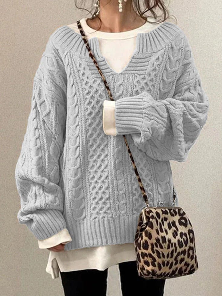 Women's ivory cable knit wool sweater with notched neckline, elegant everyday layering essential
