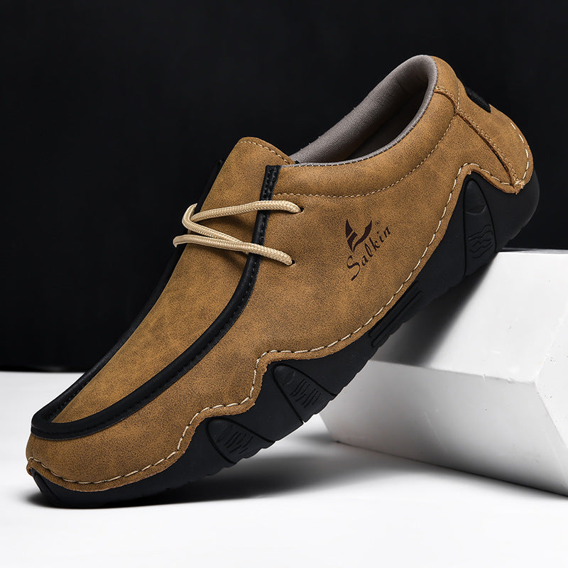 Textured two-tone leather loafers for men with cushioned insole and flexible sole for modern professionals