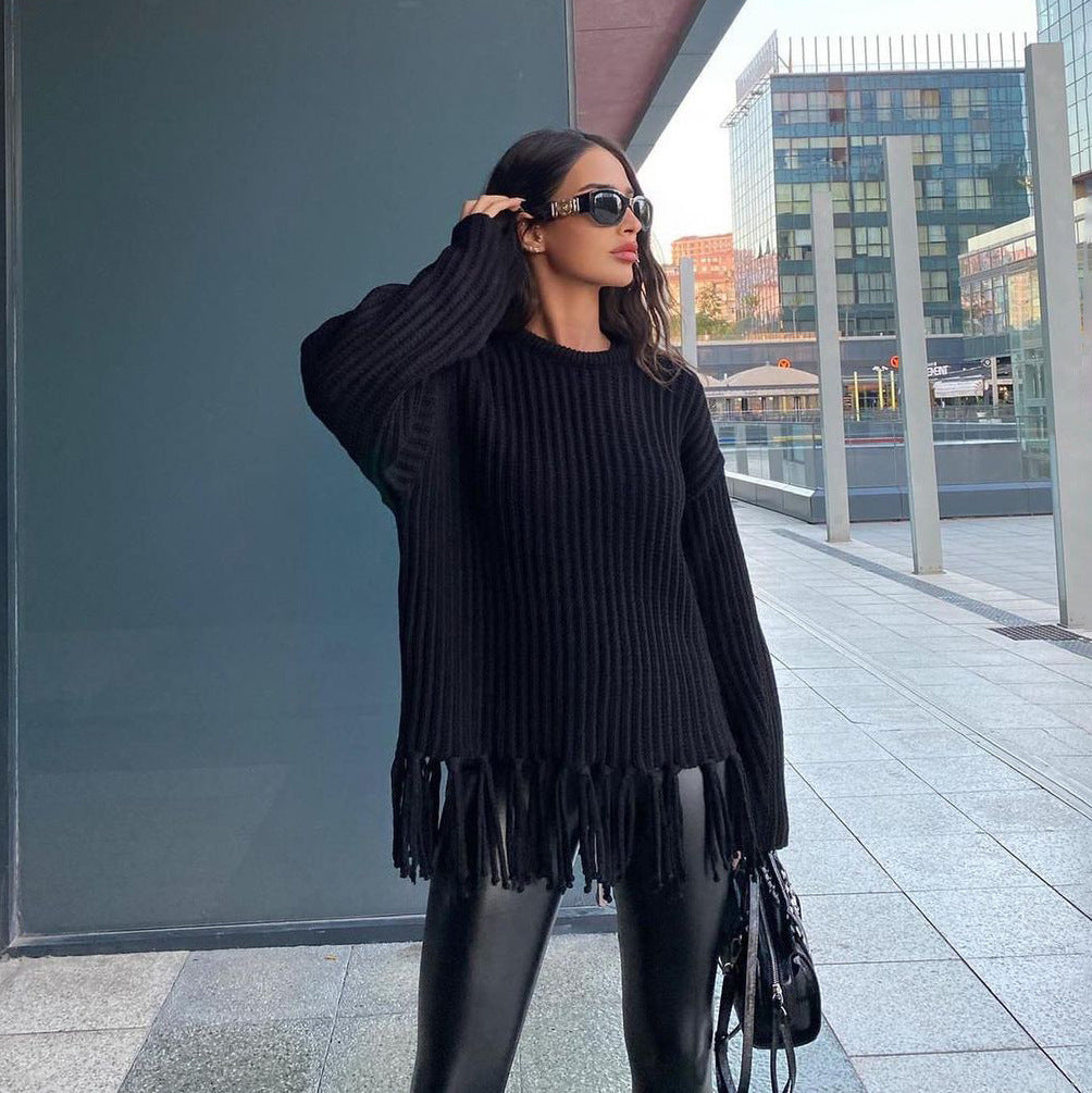 Women's oversized chunky wool knit pullover sweater with fringe hem, relaxed cozy fall style