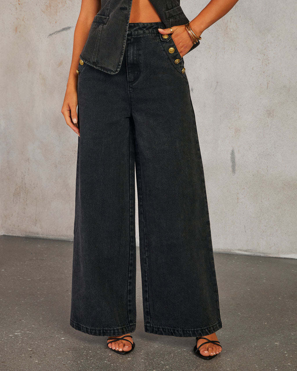 Women's tailored waist-length denim vest with button closure, fitted silhouette for chic layering