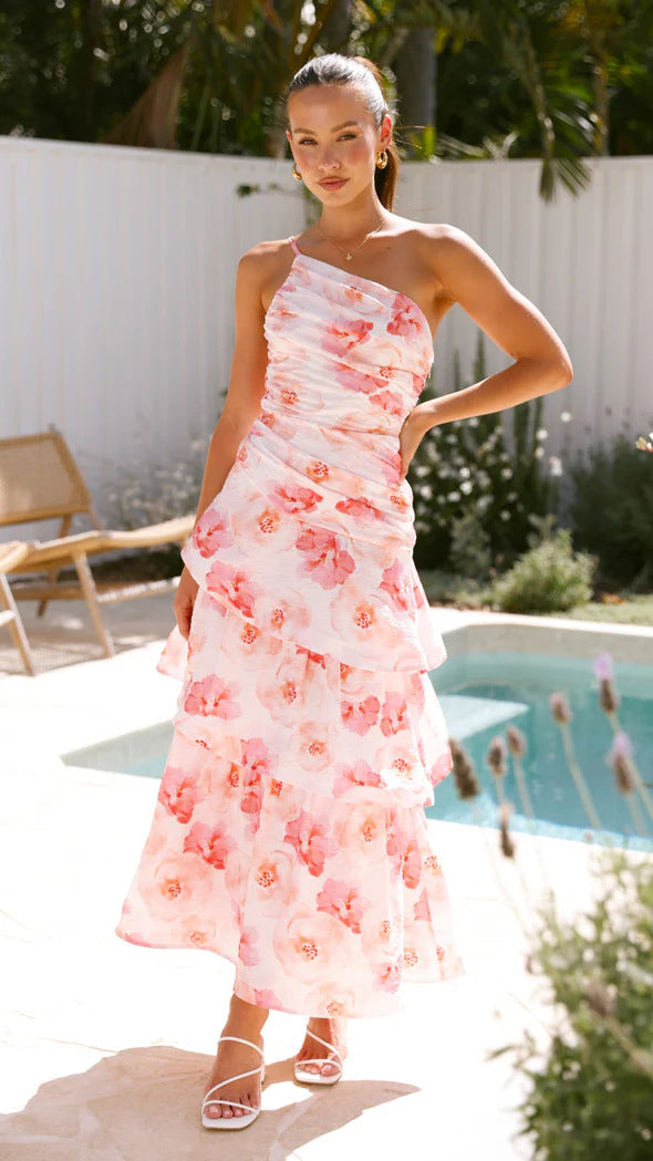 Black one-shoulder maxi dress with ruched bodice and tiered A-line skirt, elegant summer festive style
