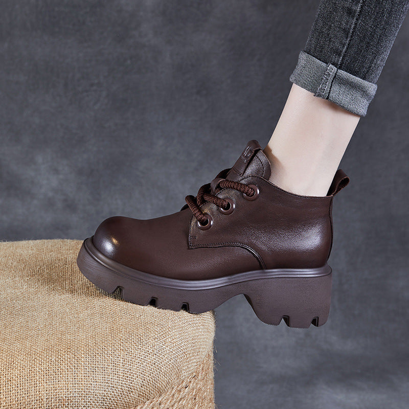 Women's black high shaft lace-up ankle boots in genuine leather with thick chunky sole