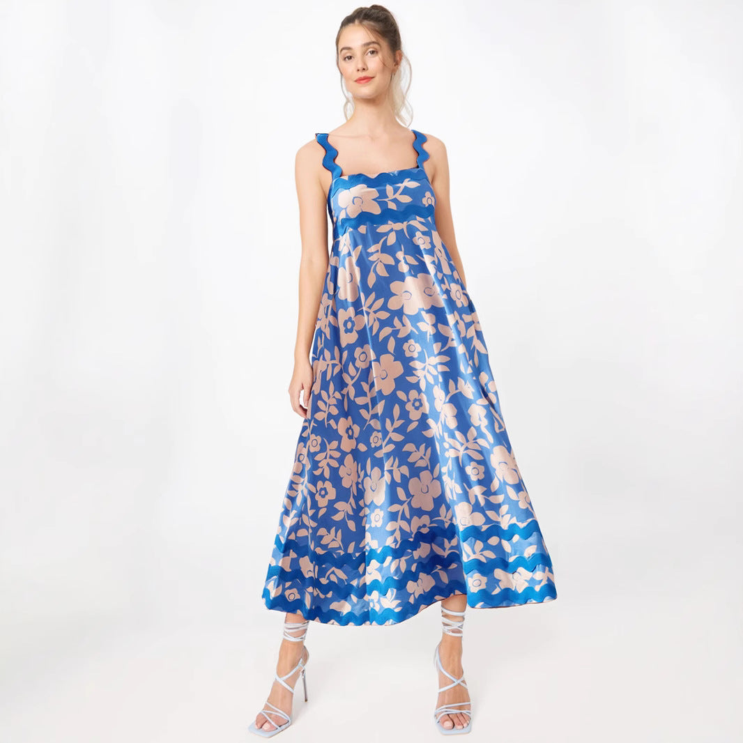 Women's lightweight floral maxi dress with flowing drape and wavy detailing for summer and festive occasions