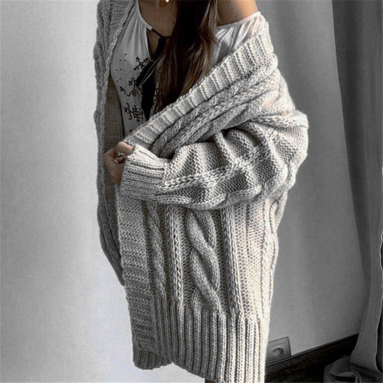 Women's oversized cable knit V-neck sweater wool blend long sleeves cozy sophisticated style