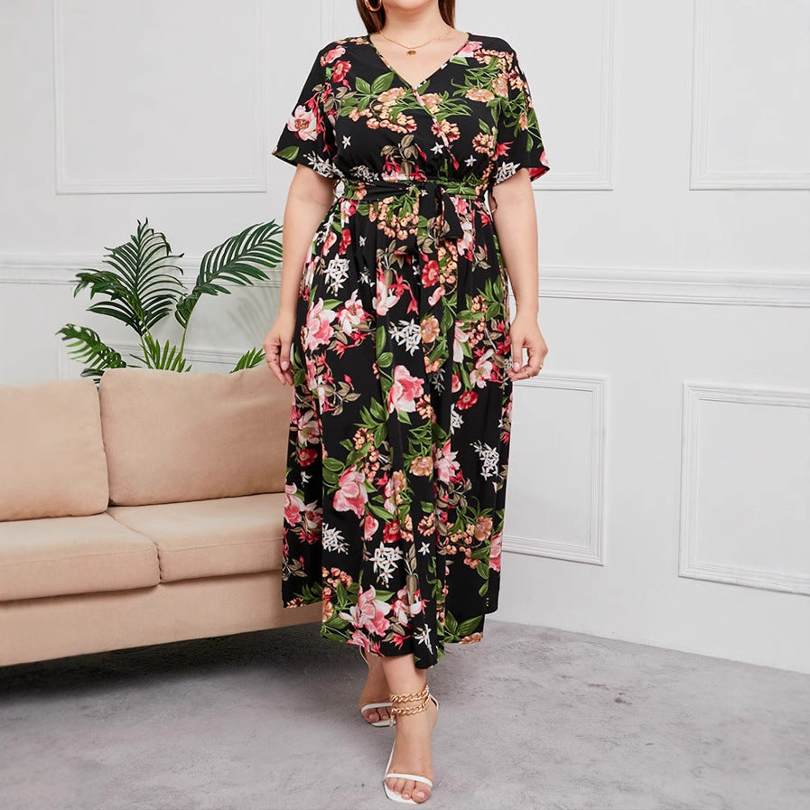 Women's floral A-line dress with V-neck, short sleeves, and waist-defining tie belt