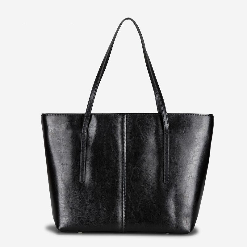 Andrea structured leather tote bag smooth finish slim straps spacious open interior everyday use