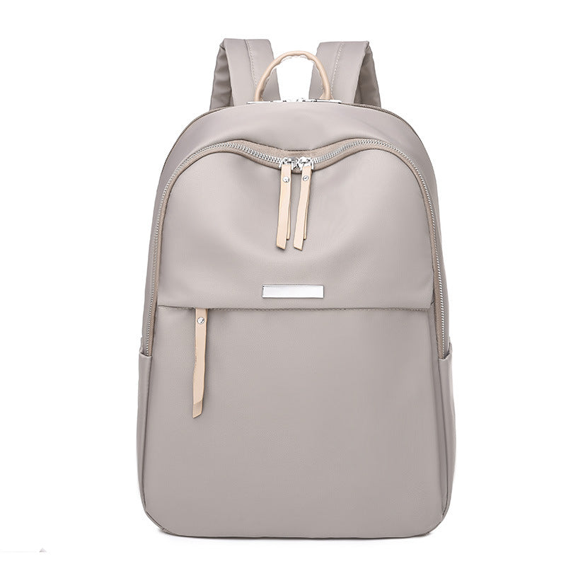 UrbanChic large-capacity Oxford fabric laptop backpack with elegant stitched band for business travel
