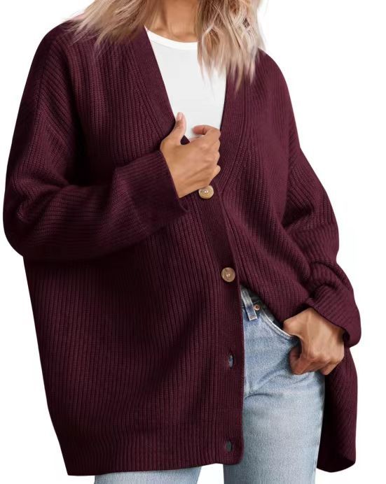 Women's striped button-down cardigan chic layering piece with bold contemporary stripe pattern