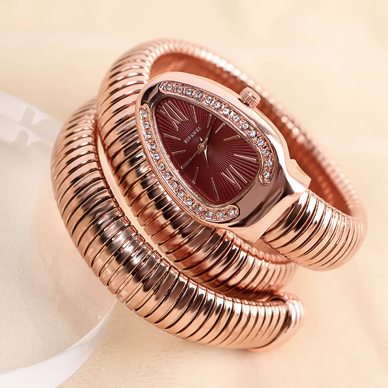 Women's snake-inspired quartz watch with custom bracelet, lightweight elegant gold-tone wrist accessory
