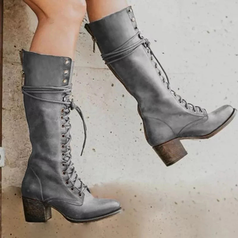 Women's black lace-up knee-high boots with block heel, bold contemporary style and adjustable front lacing