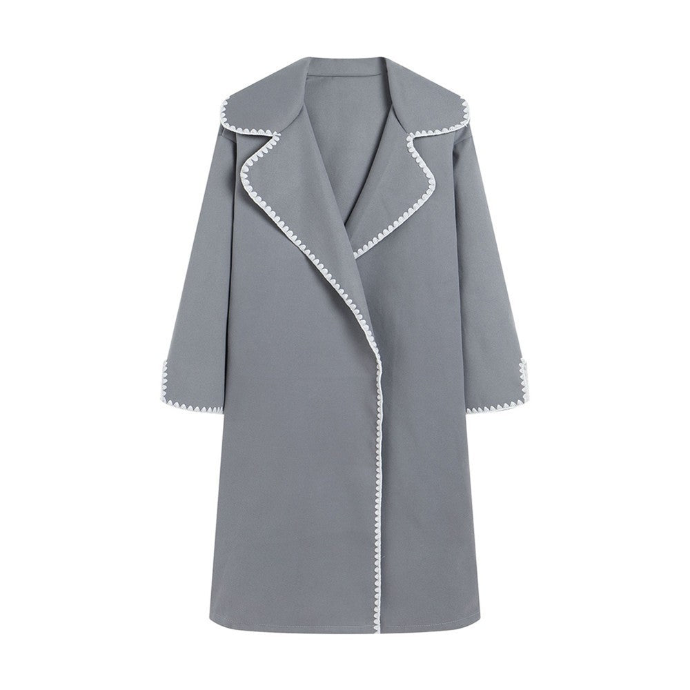 Women's oversized wool windbreaker jacket with lapel collar and embroidered shell detail, city-chic style