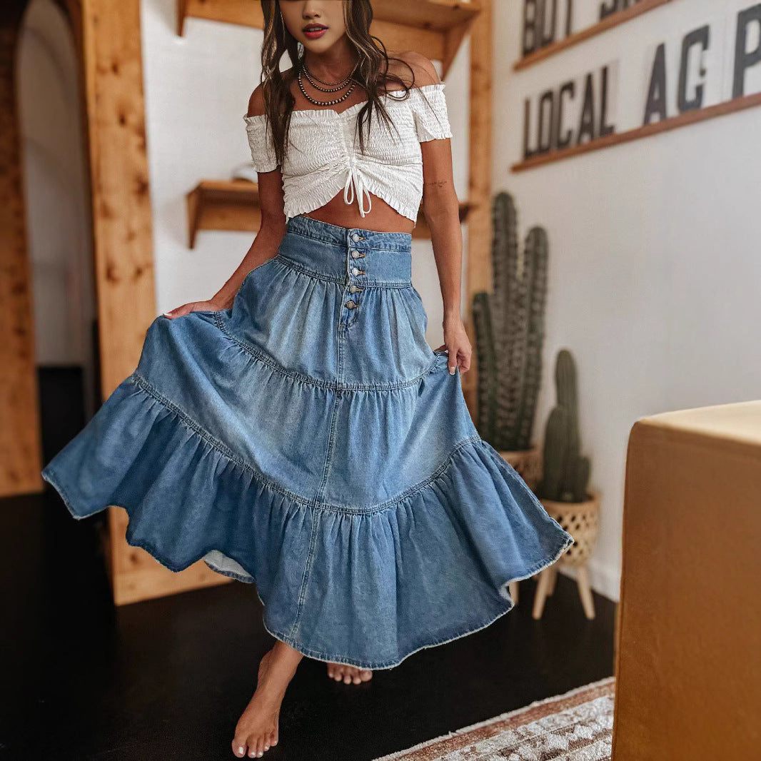 Women's blue denim A-line midi skirt with layered design and front button closure for everyday chic