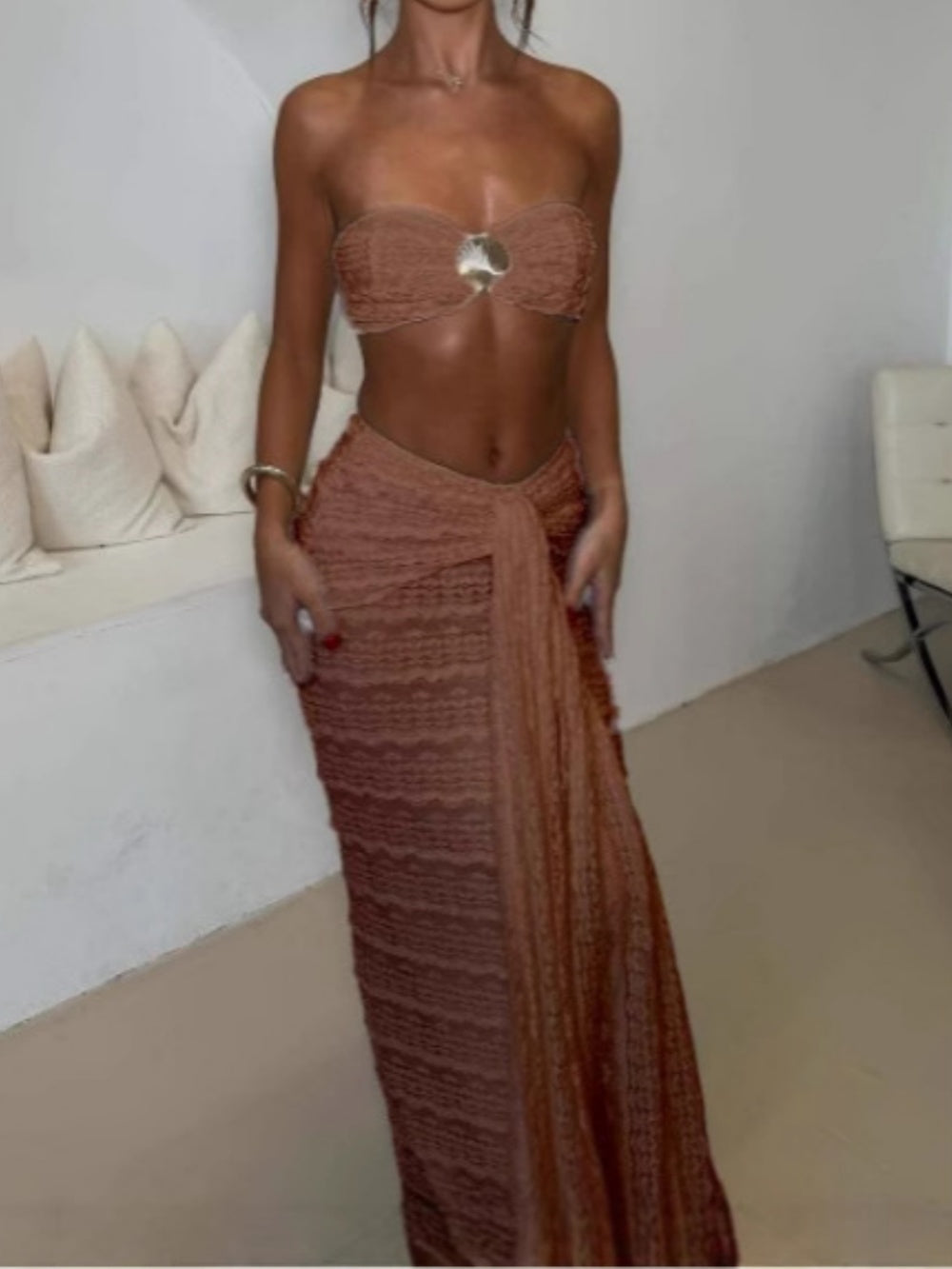 Women's shell two-piece swimsuit set with strapless bandeau top, flowing maxi skirt, and gold shell accents