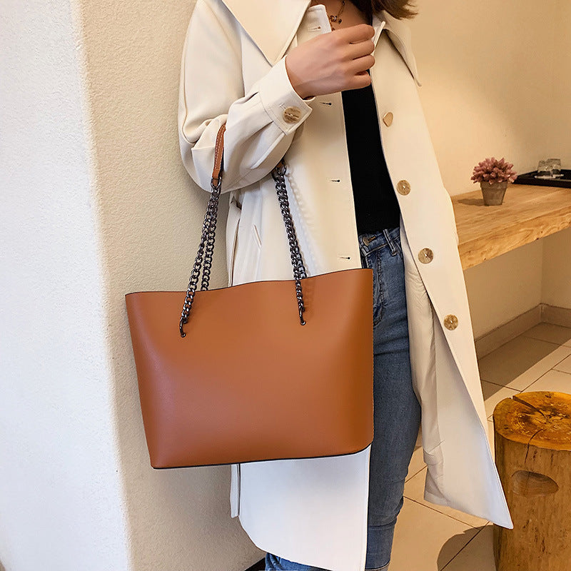 Structured vegan leather tote shoulder bag with chain strap, spacious interior, polished everyday style