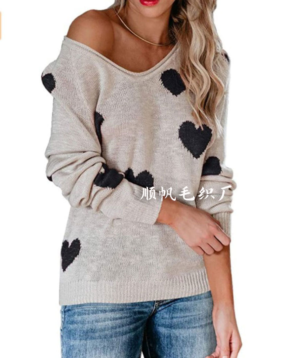 Women's cream relaxed-fit knit sweater with playful woven heart pattern for cozy winter style