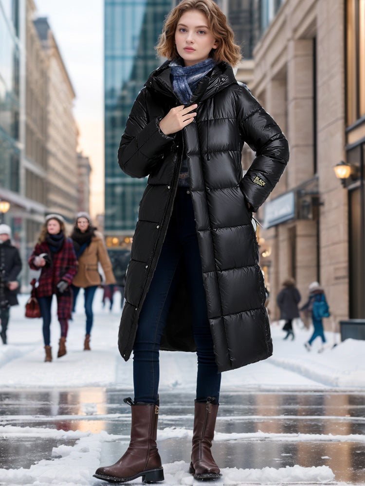 Women's long hooded puffer coat in quilted design, sleek urban silhouette for cozy winter warmth