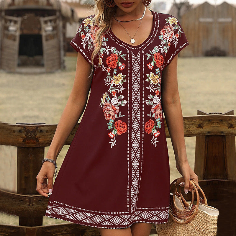 Women's relaxed-fit cotton tunic dress with V-neck, short sleeves, and floral embroidery detail