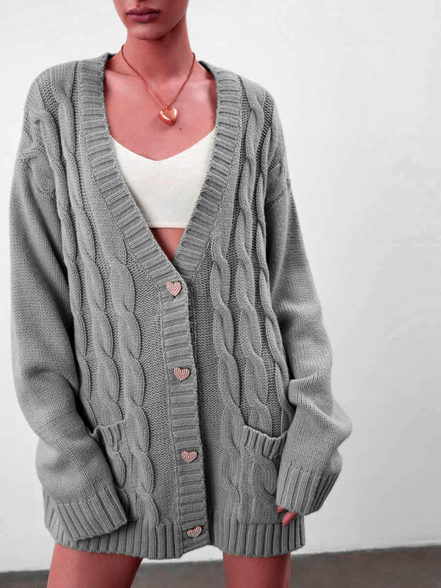 Women's oversized chunky cable knit cardigan with heart buttons and pockets, cozy casual style