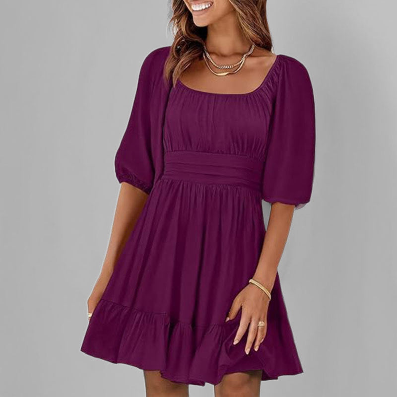 Women's white cotton fit-and-flare dress with square neckline, puff sleeves, and ruffle hem