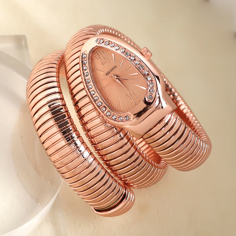 Women's snake-inspired quartz watch with custom bracelet, lightweight elegant gold-tone accessory