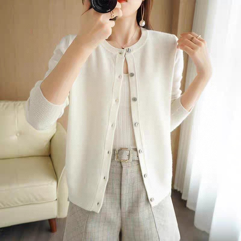 Women's relaxed fit soft knit cardigan with button front closure and ribbed trim for cozy layering