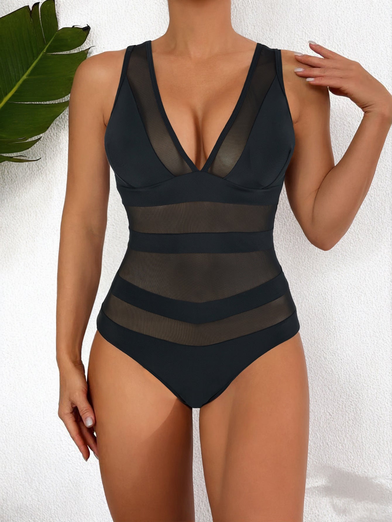 Women's form-fitting one-piece swimsuit deep V-neck mesh panel high-cut leg sleek beach style