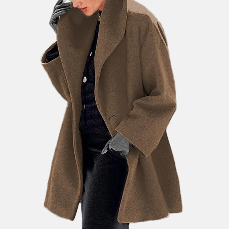 Women's oversized thigh-length coat, relaxed fit with wide lapels, cozy luxurious outerwear