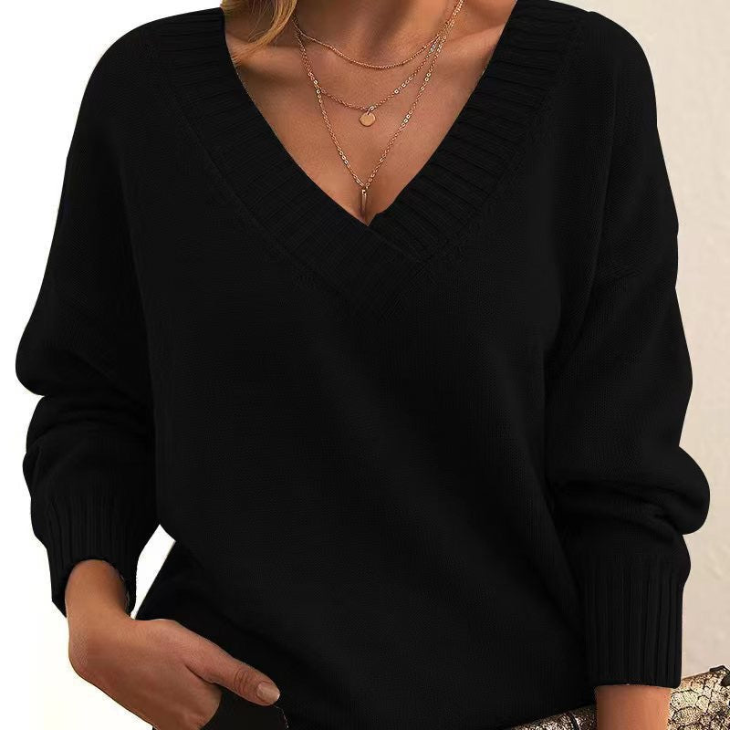 Women's relaxed v-neck knit sweater with ribbed cuffs and neckline for cozy all-day comfort