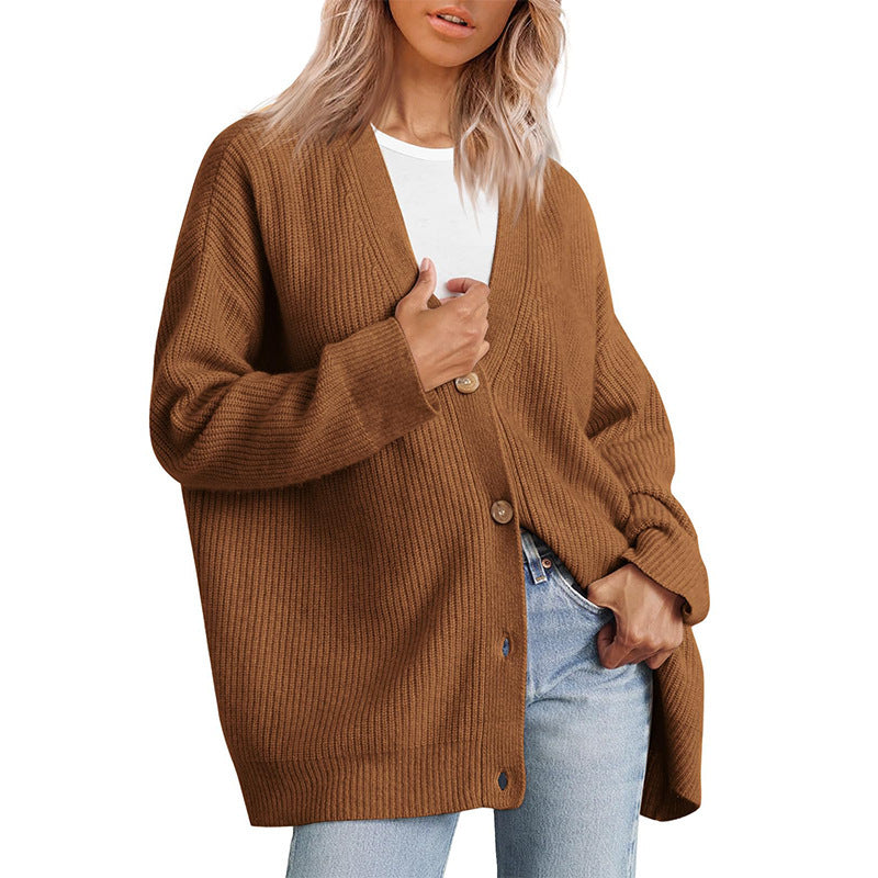 Women's striped button-down cardigan chic layering piece with bold contemporary stripe pattern