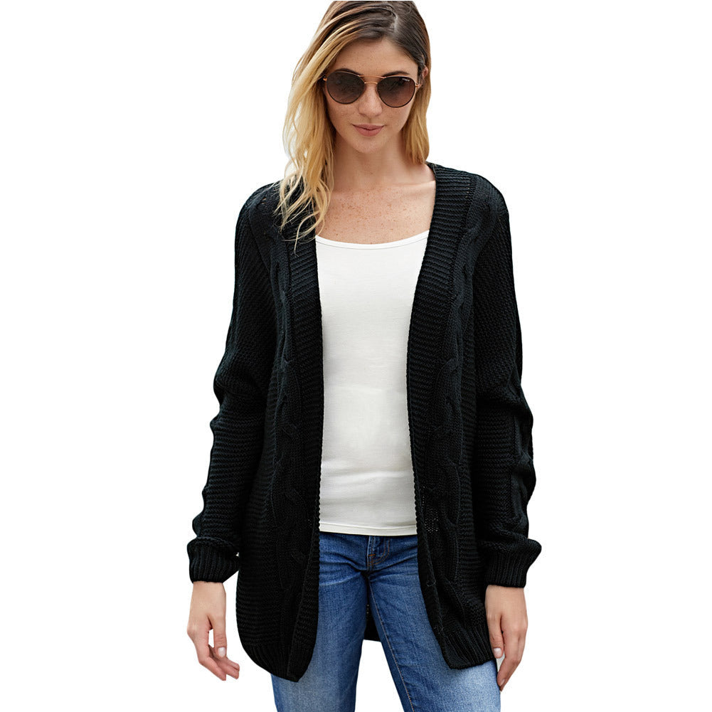 Women's oversized open-front cardigan with chunky cable-knit texture, cozy everyday layering piece