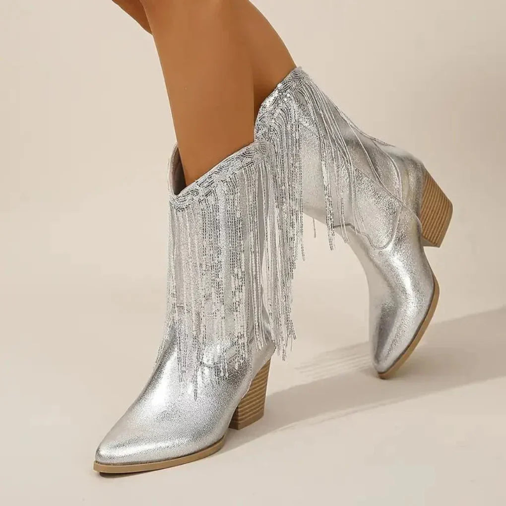 Women's metallic silver fringe high heel boots with bold glam statement and dynamic movement detailing