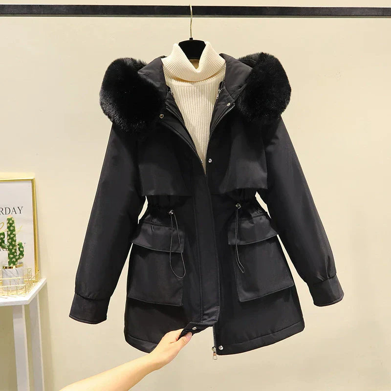 Women's tailored parka jacket with faux fur hood, quilted lining, and zip front closure