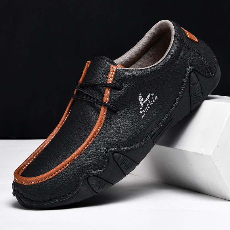 Textured two-tone leather loafers for men with cushioned insole and flexible sole, modern professional style