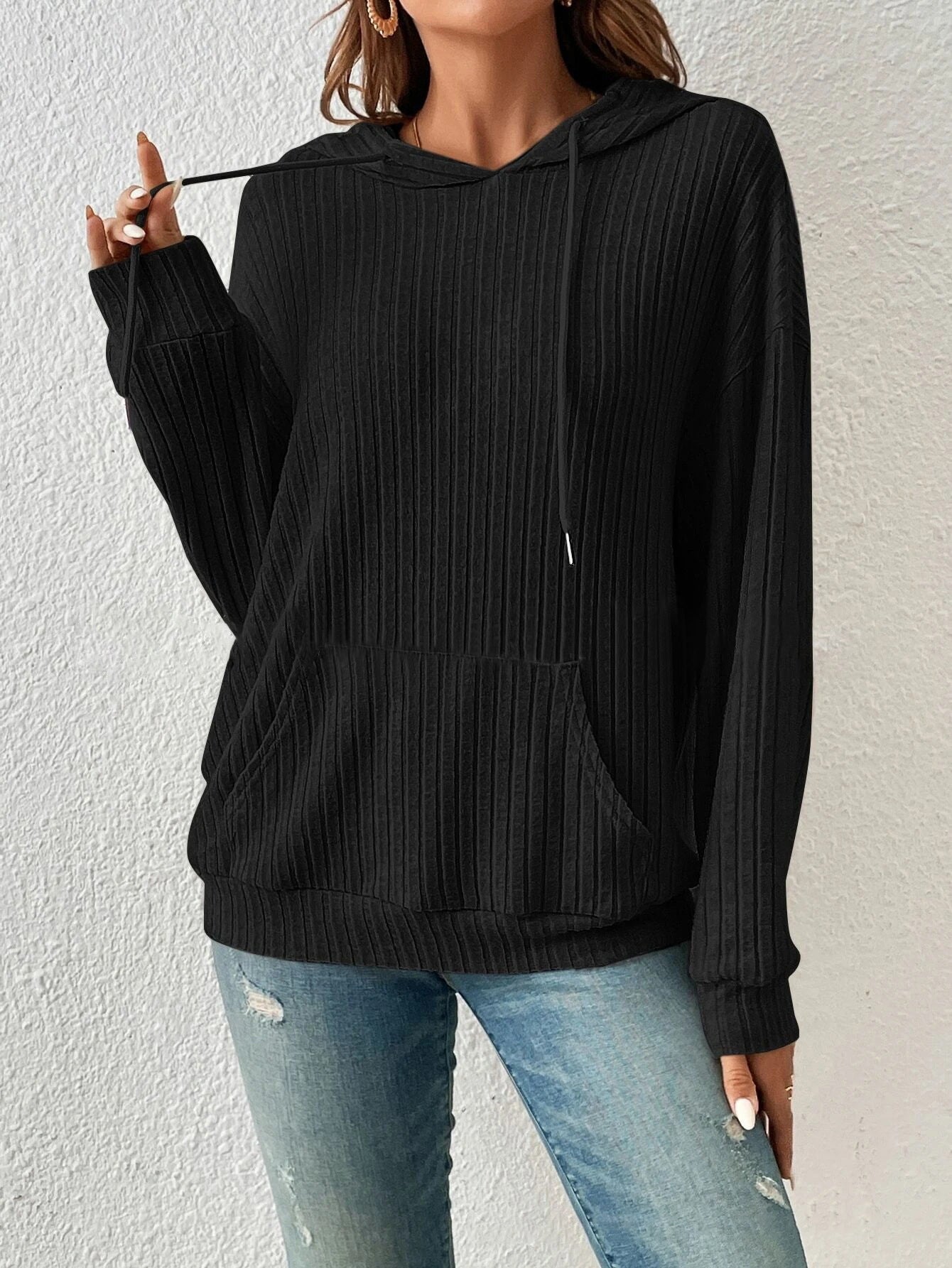 Women's relaxed-fit ribbed knit hoodie in cozy neutral tones with kangaroo pocket for everyday layering