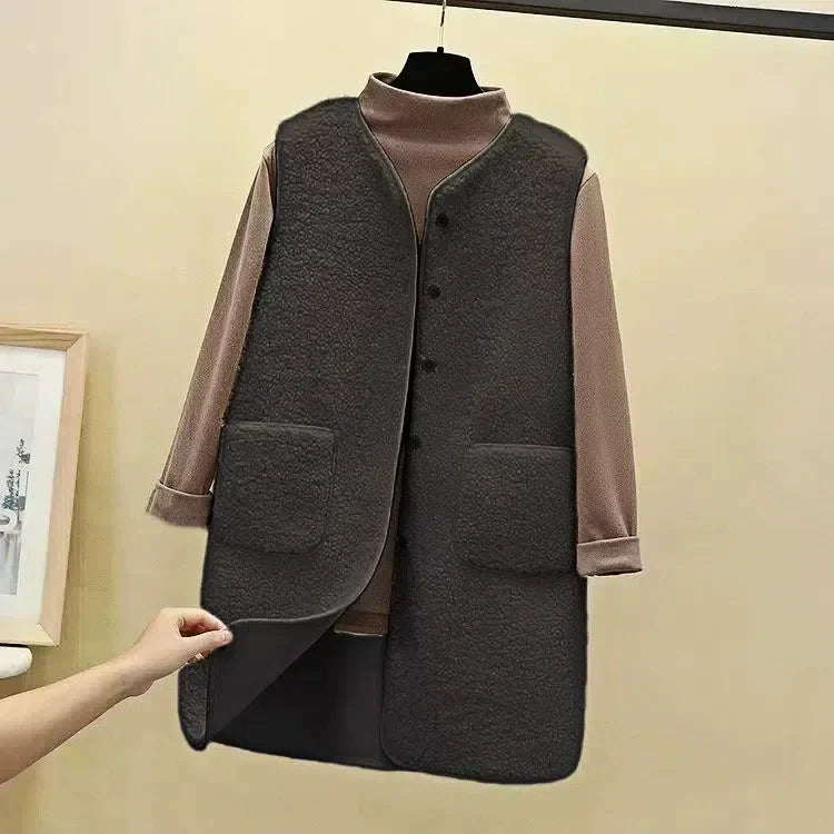 Women's plush fleece longline vest open front relaxed fit with patch pockets in cozy neutral tone