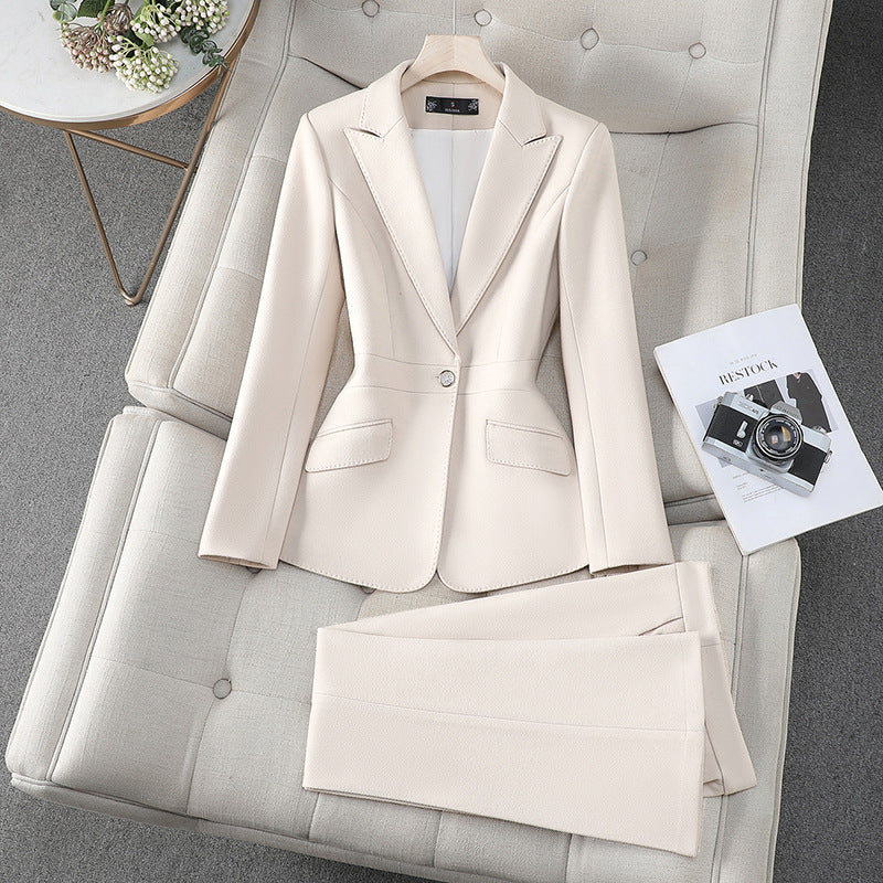 Women's formal blazer and pants set in polished tailored two-piece suit for office professional style