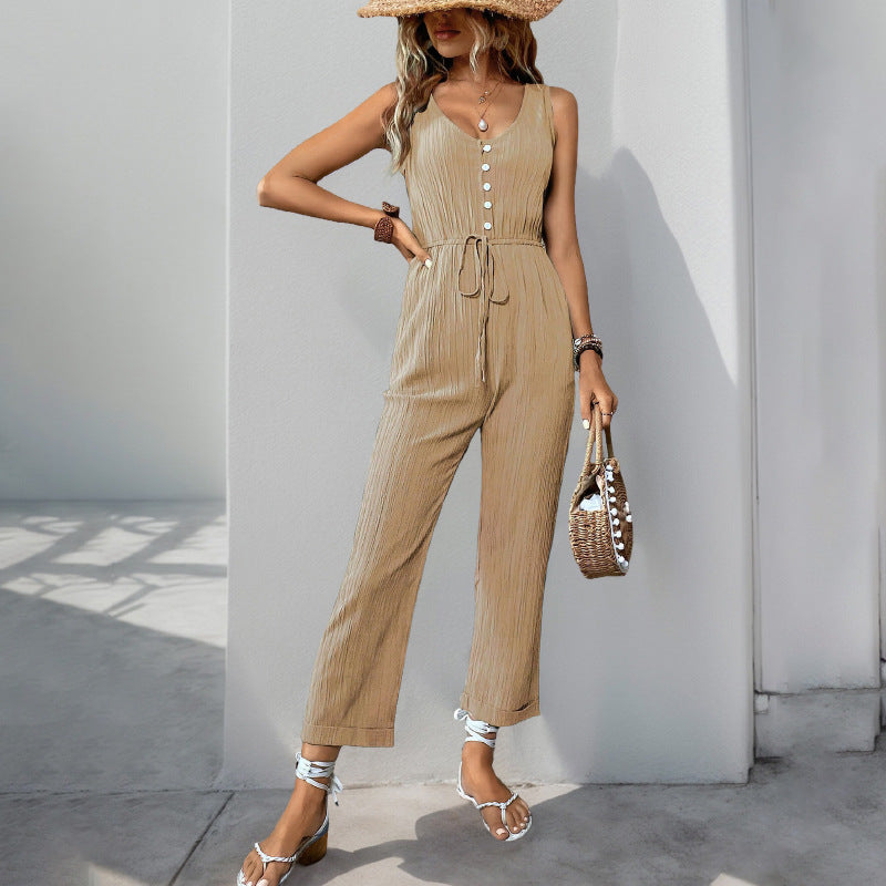 Women's sleeveless relaxed-fit jumpsuit in textured fabric with V-neck and belted waist