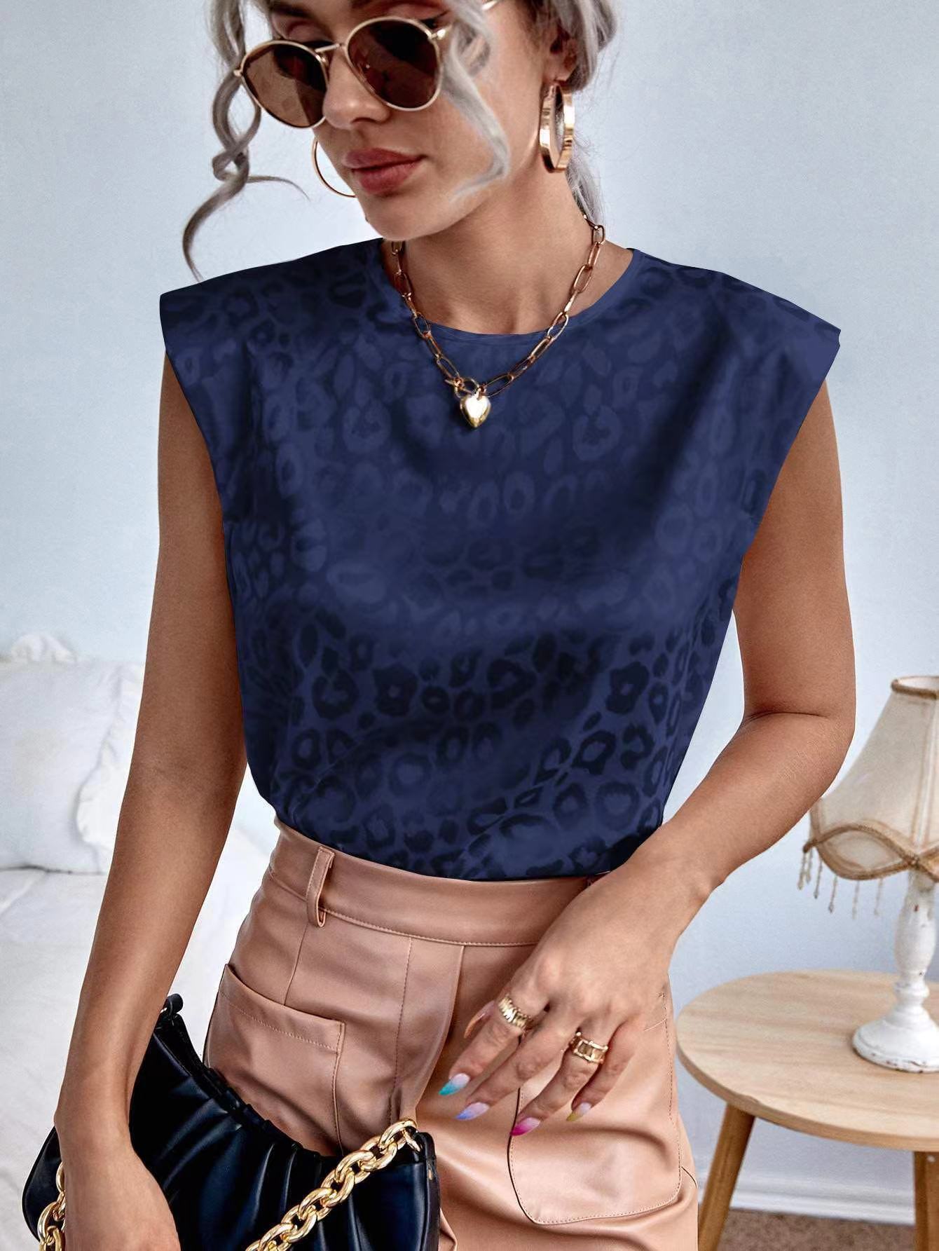 Women's relaxed fit crew neck top featuring bold animal print, breathable fabric, short sleeves