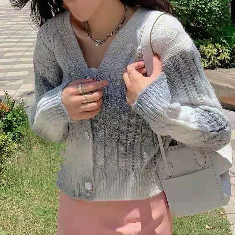 Women's cream cable knit cardigan relaxed fit button front with voluminous sleeves cozy layer