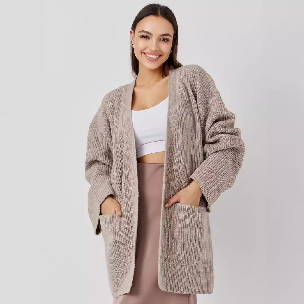 Women's oversized knit cardigan cozy chic essential with functional pockets, soft fiber blend layering piece