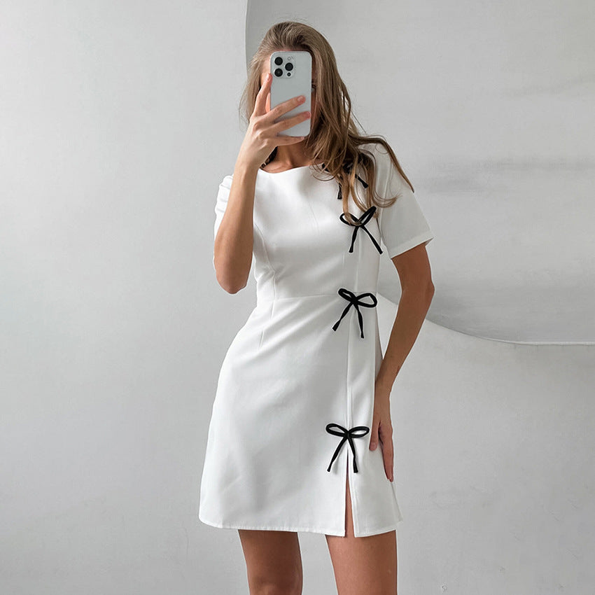 Women's A-line mini dress with delicate side-seam bow details, round neck, flattering feminine silhouette