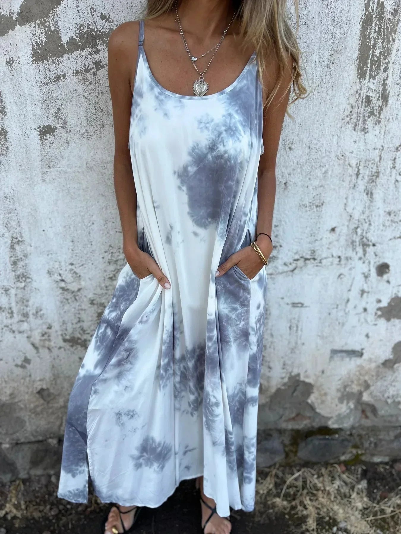 Women's flowy maxi dress with adjustable straps, relaxed silhouette, and functional pockets for everyday wear