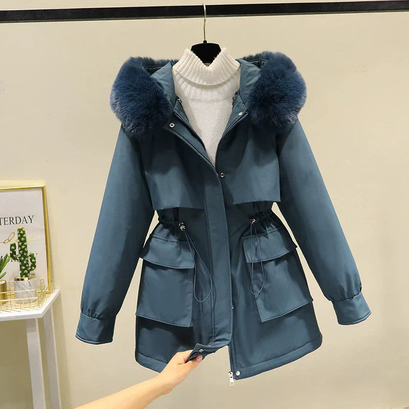 Women's tailored parka jacket with faux fur hood, quilted lining, and zip front closure