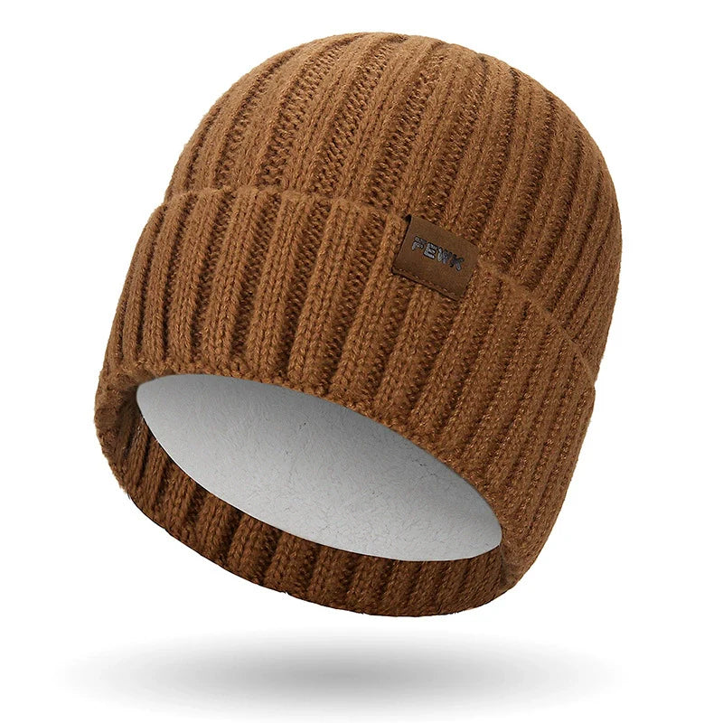 Dark knit unisex beanie with fold-over ribbed cuff and subtle stitched patch for casual everyday wear