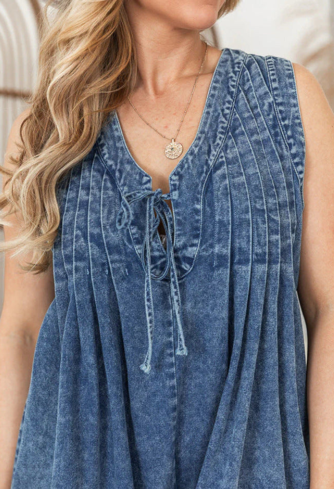 Women's loose fit sleeveless denim romper with lace V-neck detail in classic blue denim