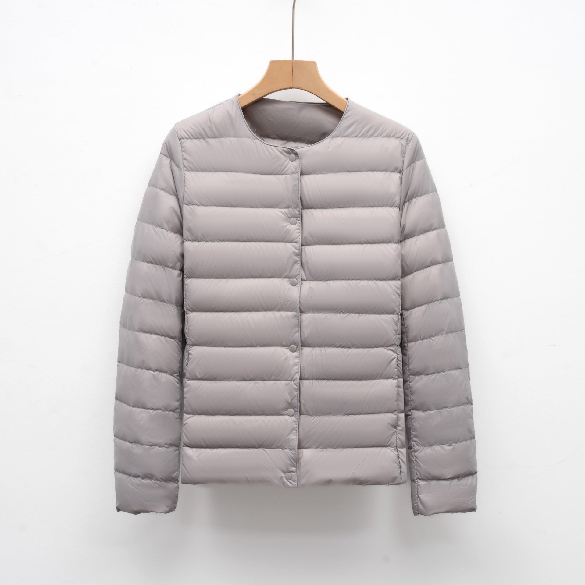 Women's slim fit quilted down jacket hip length snap front lightweight warm layer