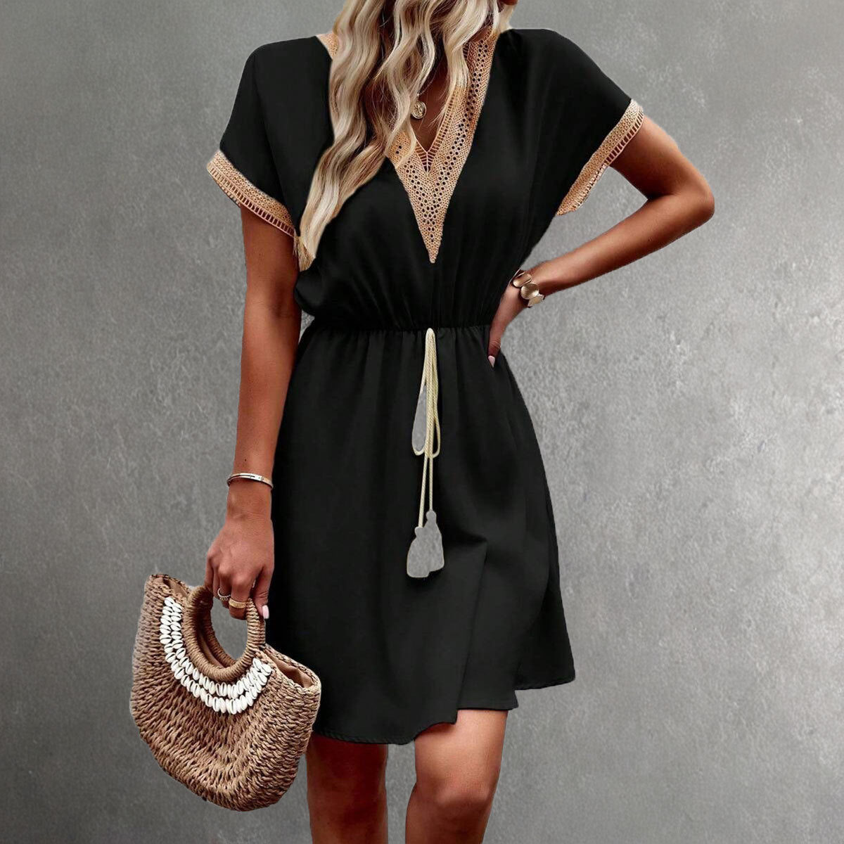 Women's flowy mini dress with V-neck lace trim and elastic waist, light summer style