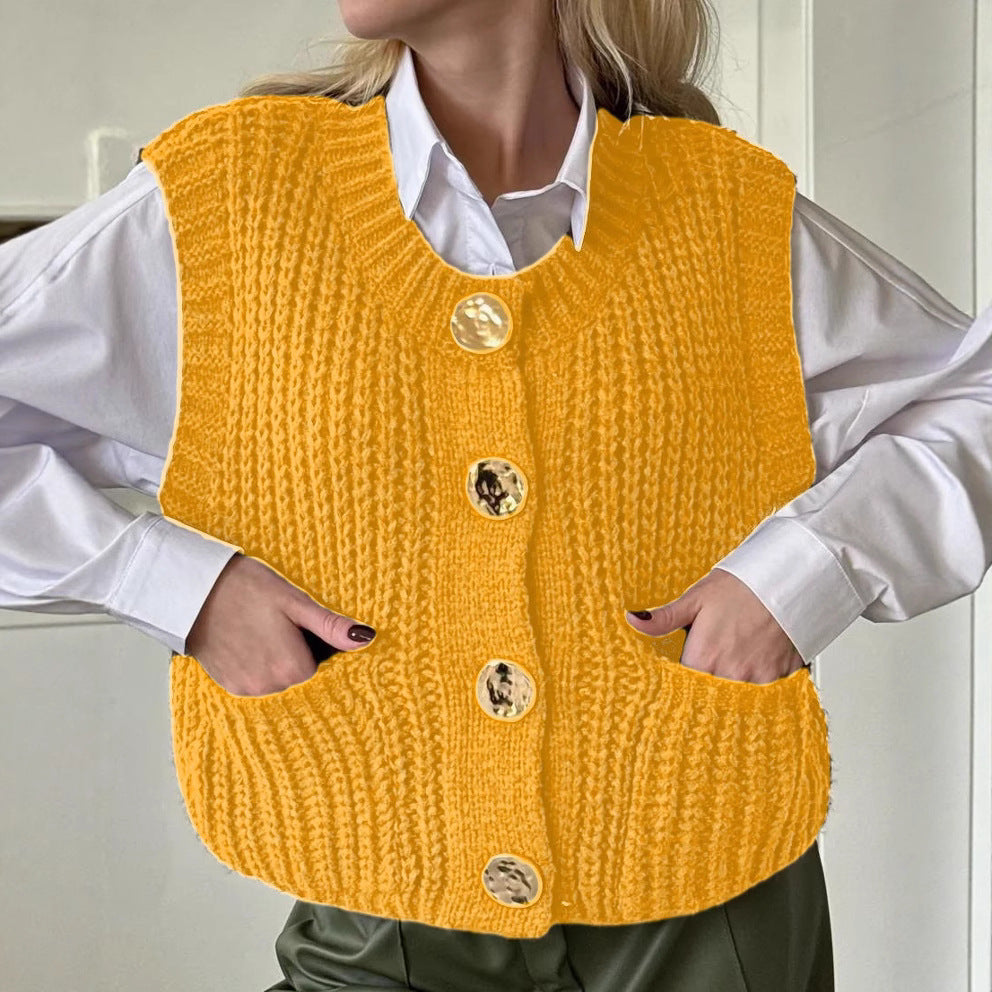 Women's wool blend oversized knitted vest with button front, ribbed texture, and side pockets